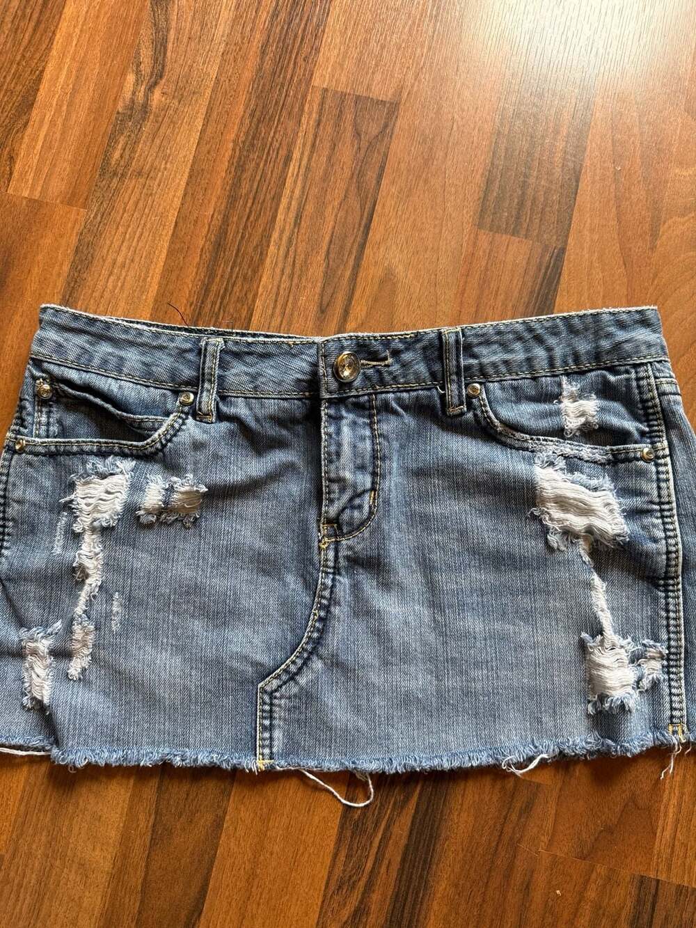 Vanity Distressed Denim Mini Skirt with Frayed Hem